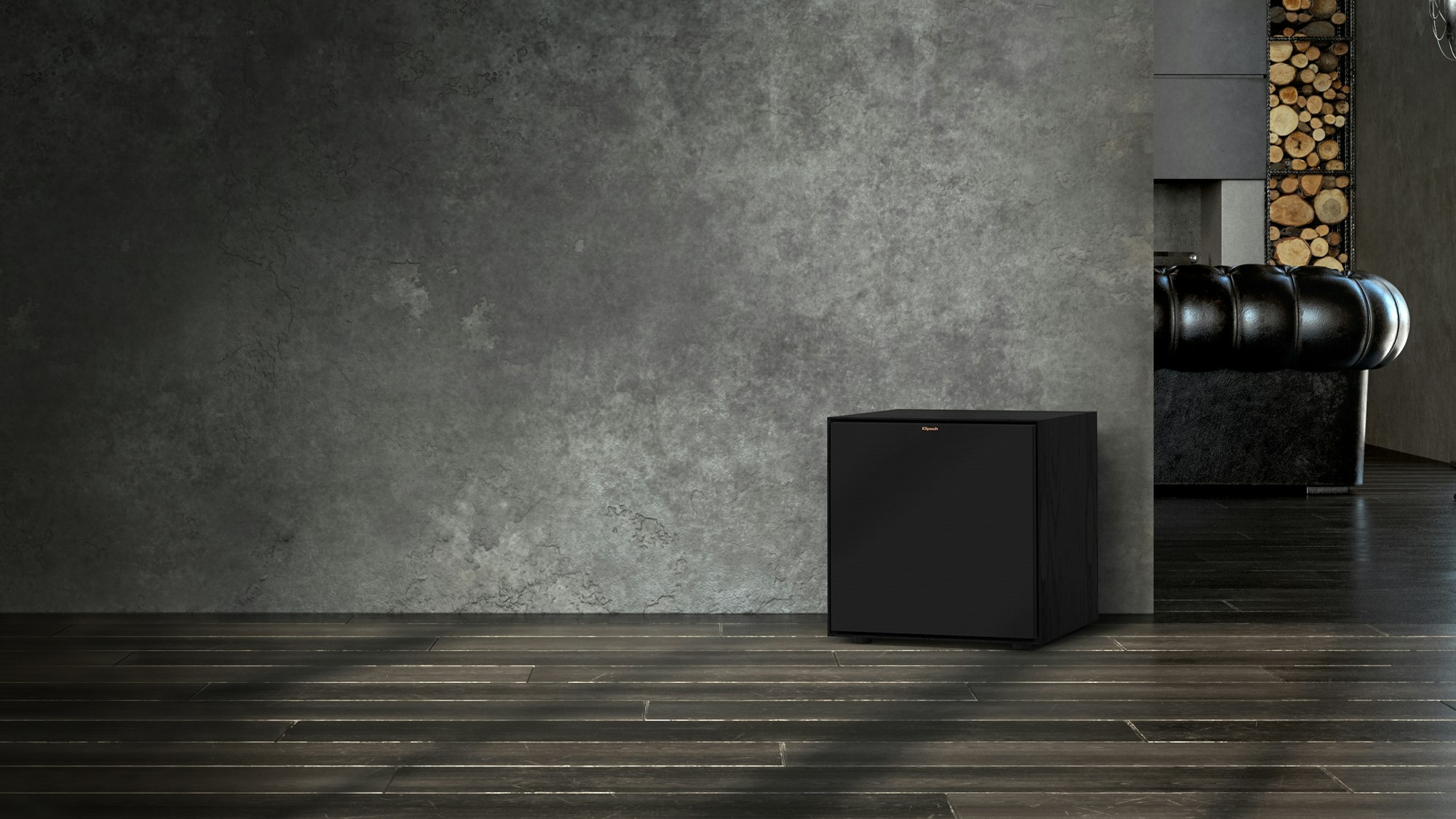 Reference Subwoofer R-121SW in front of a grey wall with the grille on